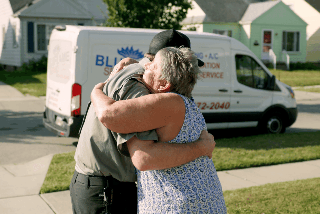 Bluflame customer hugging tech