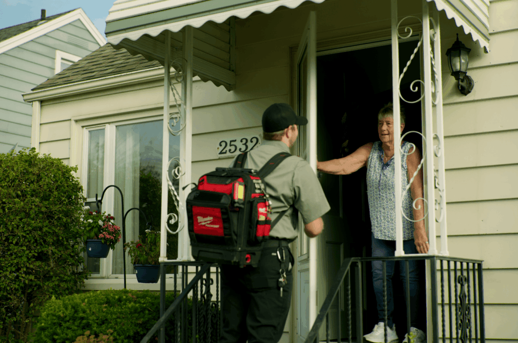 Bluflame tech greeting customer at door 2